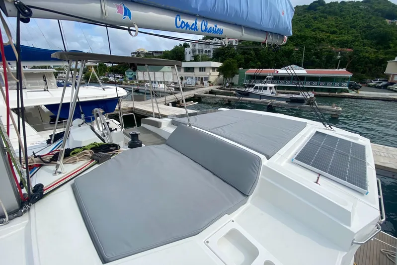 Mirabella Yacht Photos Pics Modern Bali 4.2 catamaran docked, featuring solar panels and comfortable seating, 2022 model.
