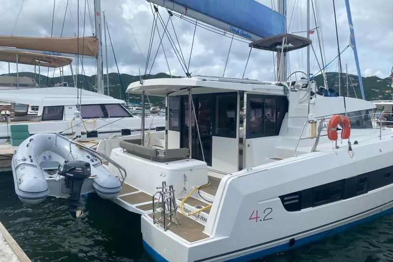 Mirabella Yacht Photos Pics 2022 Bali 4.2 catamaran docked with inflatable dinghy attached.