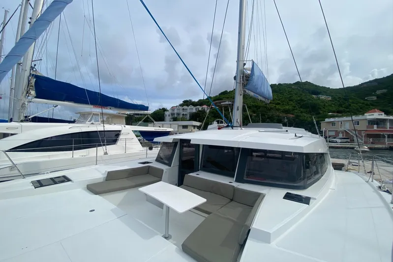Mirabella Yacht Photos Pics 2022 Bali 4.2 catamaran with spacious deck and seating, docked at marina.