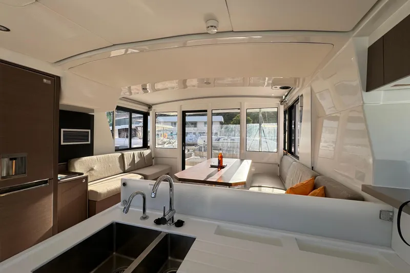 Mirabella Yacht Photos Pics Luxurious interior of 2022 Bali 4.2 yacht with modern kitchen and seating area.