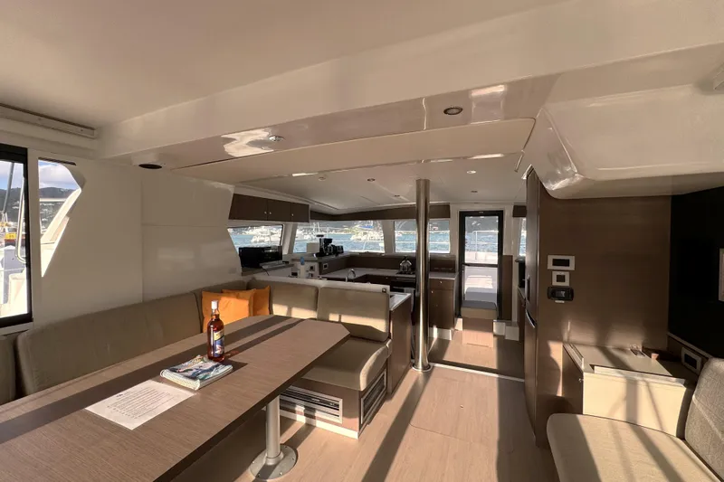 Mirabella Yacht Photos Pics Luxurious interior of 2022 Bali 4.2 catamaran with modern kitchen and seating area.