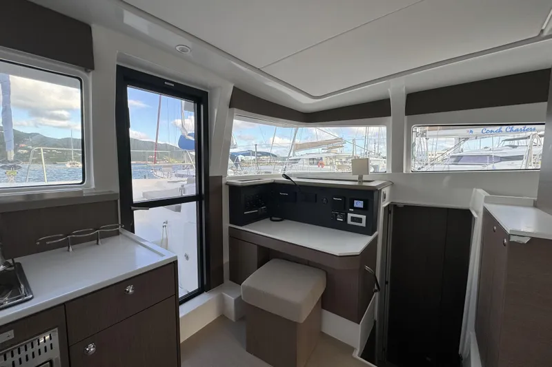 Mirabella Yacht Photos Pics Interior of 2022 Bali 4.2 catamaran with modern navigation station and panoramic windows.