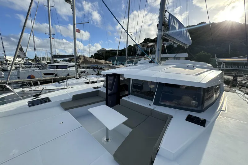 Mirabella Yacht Photos Pics Modern 2022 Bali 4.2 catamaran docked at marina under clear blue sky.