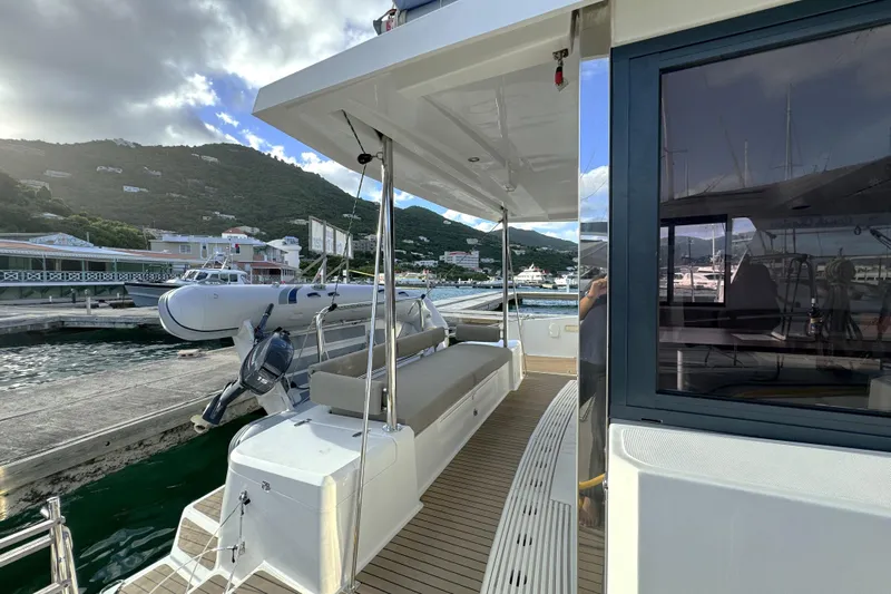 Mirabella Yacht Photos Pics Modern 2022 Bali 4.2 yacht docked at marina with scenic mountain backdrop.