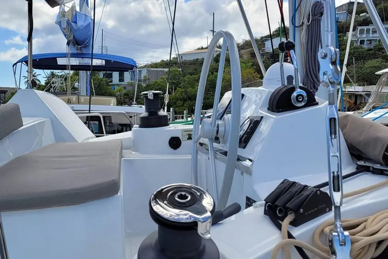 Mirabella Yacht Photos Pics Cockpit view of a 2022 Bali 4.2 yacht, featuring steering wheel and winches.