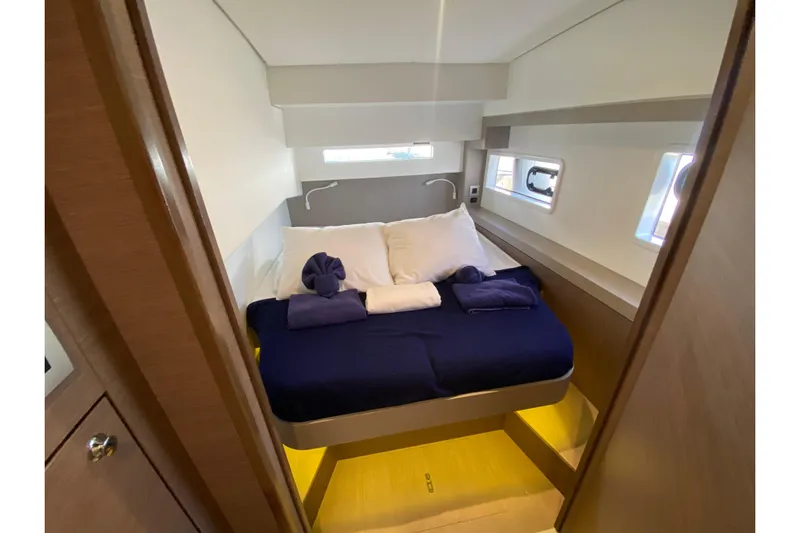 Mirabella Yacht Photos Pics Luxurious cabin interior of 2022 Bali 4.2 yacht with cozy bedding and modern design.