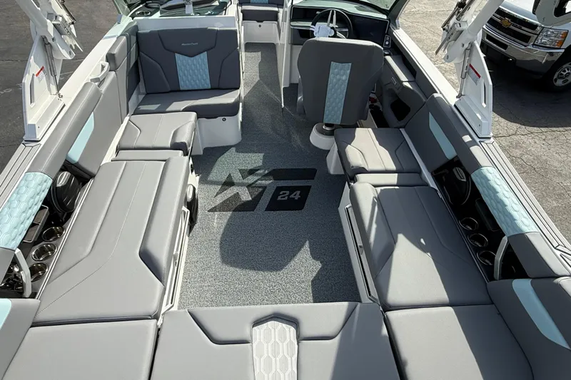  Yacht Photos Pics 2026 MasterCraft XT24 boat interior with gray and blue seating, modern design.
