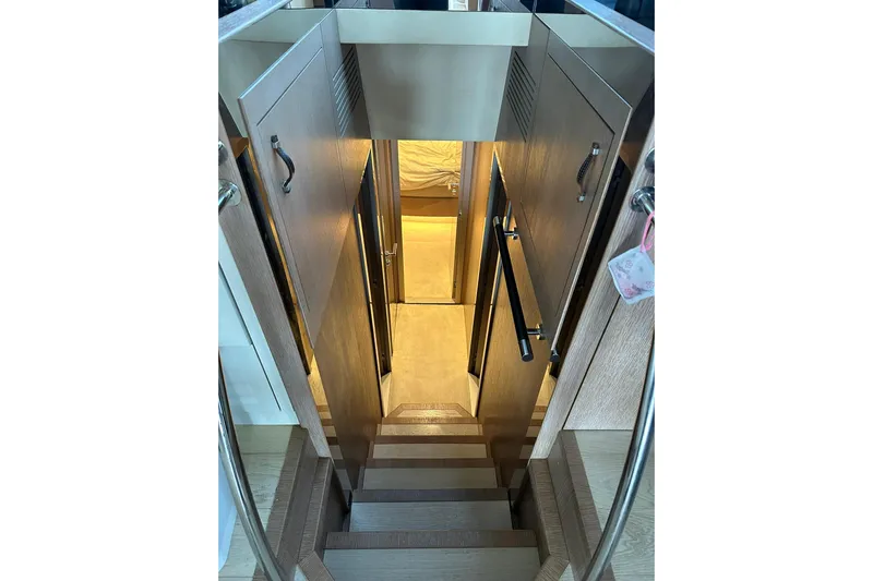  Yacht Photos Pics Staircase leading to cabin interior of 2019 Monte Carlo Yachts MCY 70.