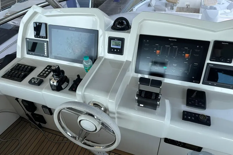  Yacht Photos Pics Cockpit of 2019 Monte Carlo Yachts MCY 70 with advanced navigation systems.