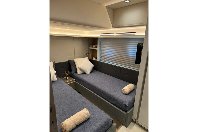  Yacht Photos Pics Luxurious 2019 Monte Carlo Yachts MCY 70 cabin with twin beds and modern decor.
