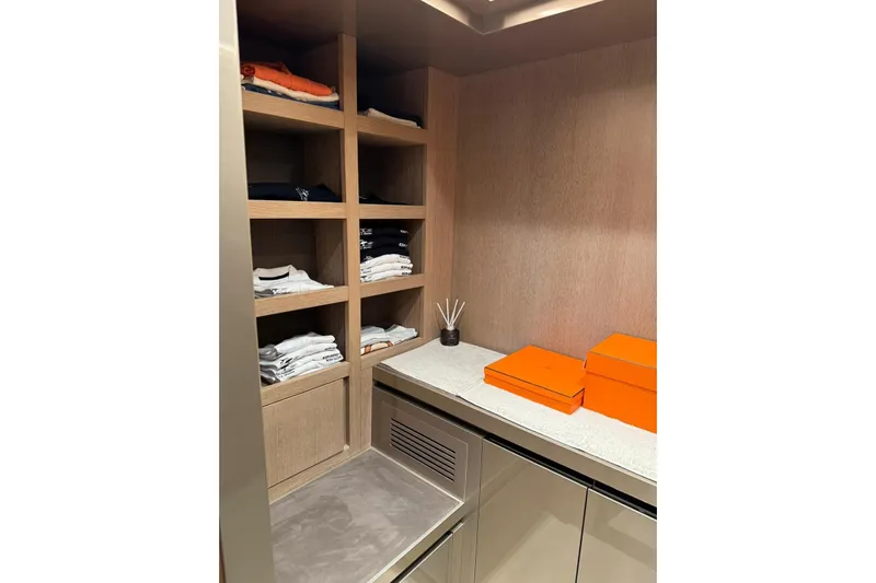  Yacht Photos Pics Luxurious Monte Carlo Yachts MCY 70 interior closet with shelves and orange boxes, 2019 model.