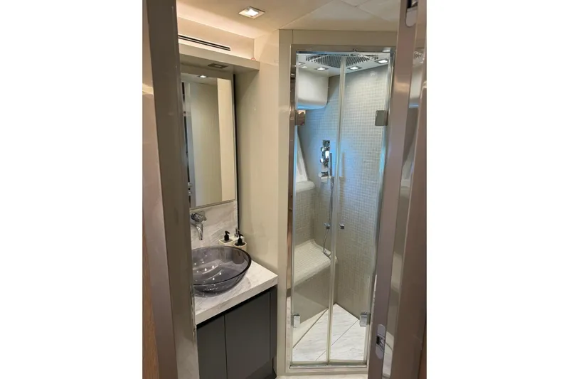  Yacht Photos Pics Luxurious bathroom in 2019 Monte Carlo Yachts MCY 70 with modern shower and elegant sink.