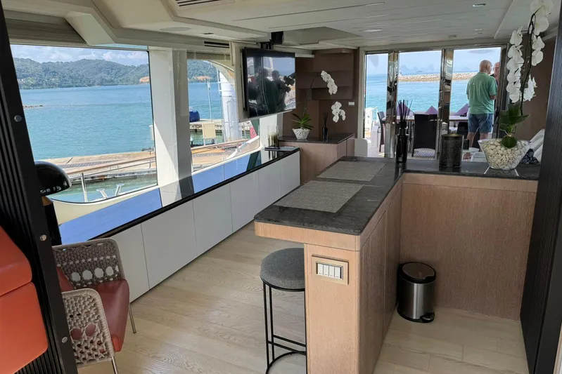  Yacht Photos Pics Luxurious interior of 2019 Monte Carlo Yachts MCY 70 with ocean view and elegant decor.