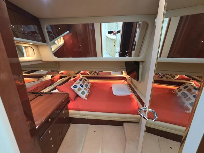  Yacht Photos Pics Luxurious cabin interior of 2002 Sea Ray 560 Sedan Bridge yacht with cozy bedding.
