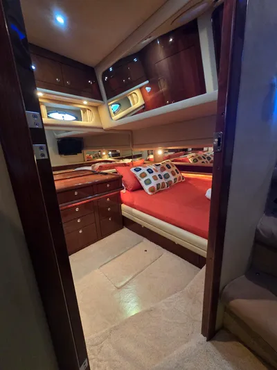  Yacht Photos Pics Luxurious cabin interior of 2002 Sea Ray 560 Sedan Bridge yacht with cozy bedding.