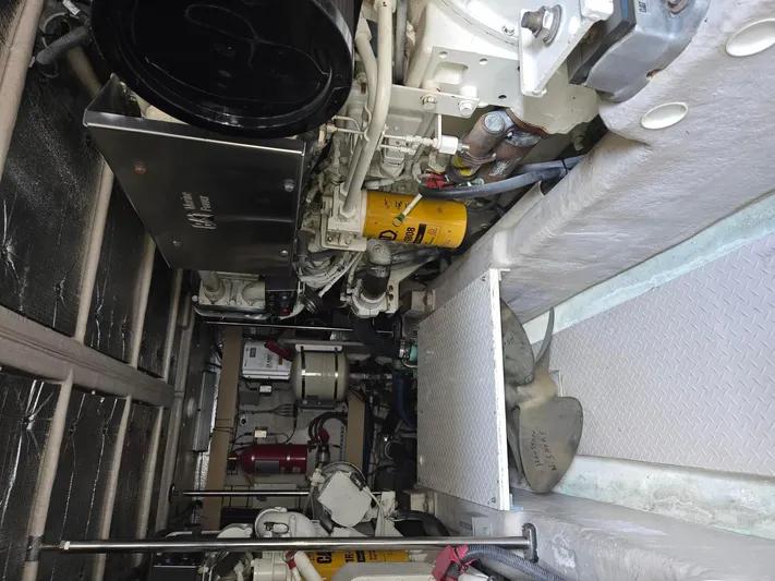  Yacht Photos Pics Engine room of a 2002 Sea Ray 560 Sedan Bridge, showcasing mechanical components and equipment.