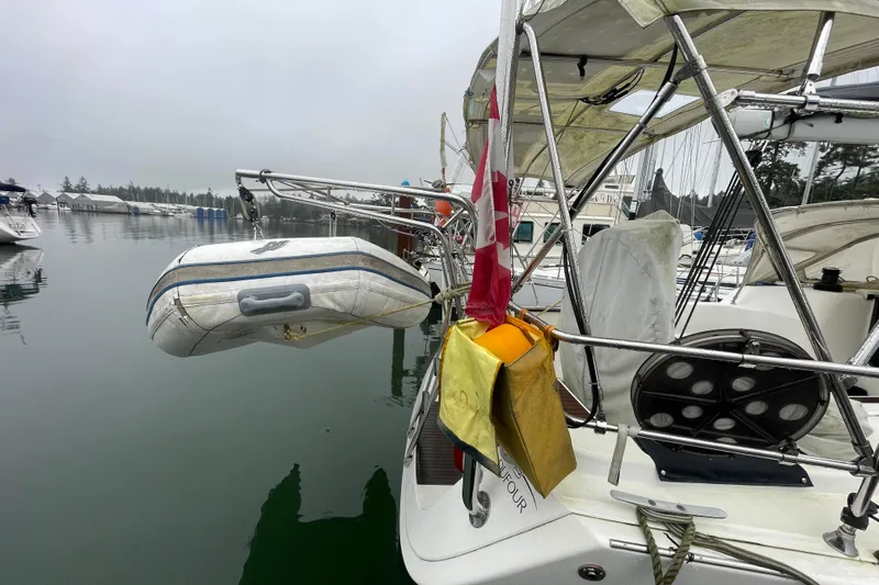 New Journey Yacht Photos Pics 2005 Dufour 40 Performance sailboat docked with dinghy and Canadian flag.