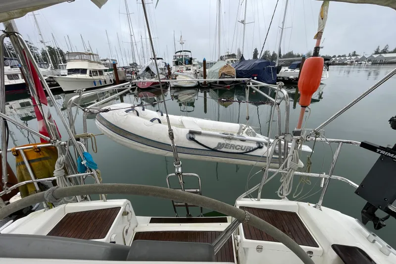 New Journey Yacht Photos Pics Dufour 40 Performance 2005 sailboat with dinghy in a marina setting.