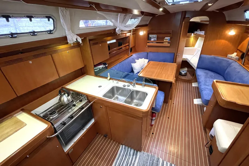 New Journey Yacht Photos Pics Interior of 2005 Dufour 40 Performance yacht with kitchen and seating area.