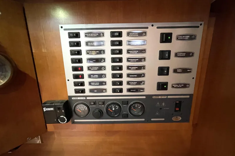 New Journey Yacht Photos Pics Control panel of a 2005 Dufour 40 Performance yacht, featuring switches and gauges.