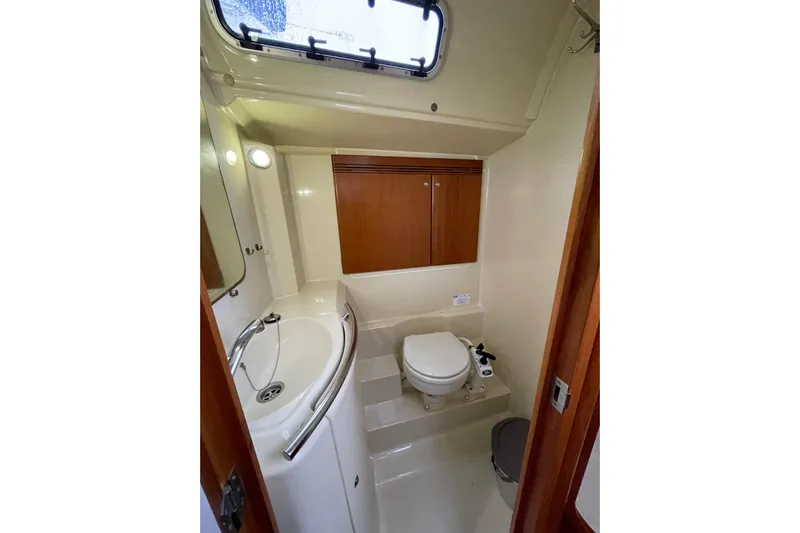 New Journey Yacht Photos Pics Bathroom interior of 2005 Dufour 40 Performance yacht with sink, toilet, and storage cabinets.
