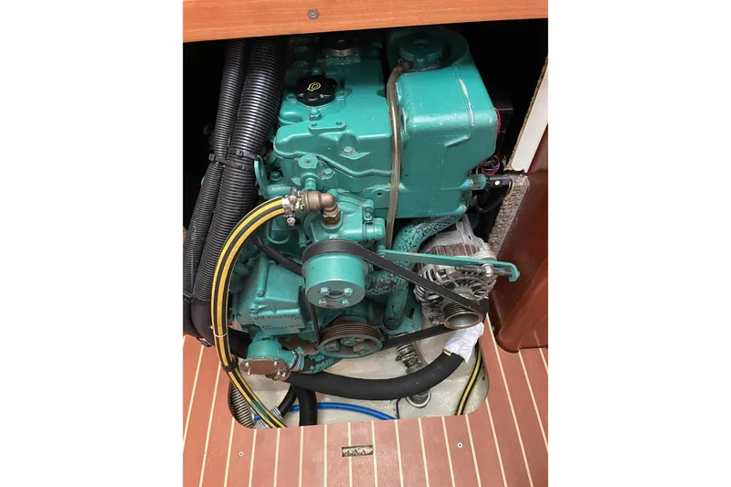 New Journey Yacht Photos Pics Engine of 2005 Dufour 40 Performance sailboat, featuring green components and visible belts.