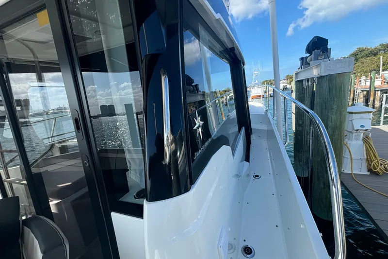 1095-953 Brokerage Josh Yacht Photos Pics 2024 Jeanneau NC Weekender 1095 Fly docked, showcasing sleek design and modern features.