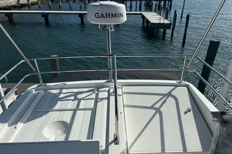 1095-953 Brokerage Josh Yacht Photos Pics 2024 Jeanneau NC Weekender 1095 Fly deck with Garmin radar, dockside view.
