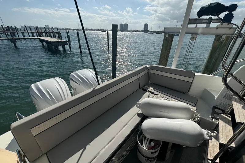 1095-953 Brokerage Josh Yacht Photos Pics 2024 Jeanneau NC Weekender 1095 Fly, rear seating area with ocean view.