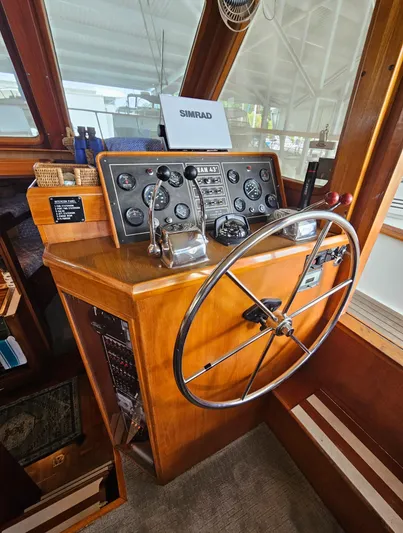 Kolea Yacht Photos Pics 1983 Ocean Alexander 43 helm with classic wooden dashboard and steering wheel.
