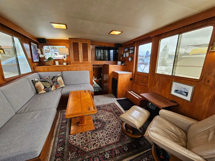 Kolea Yacht Photos Pics Interior of 1983 Ocean Alexander 43 yacht with cozy seating and wooden accents.