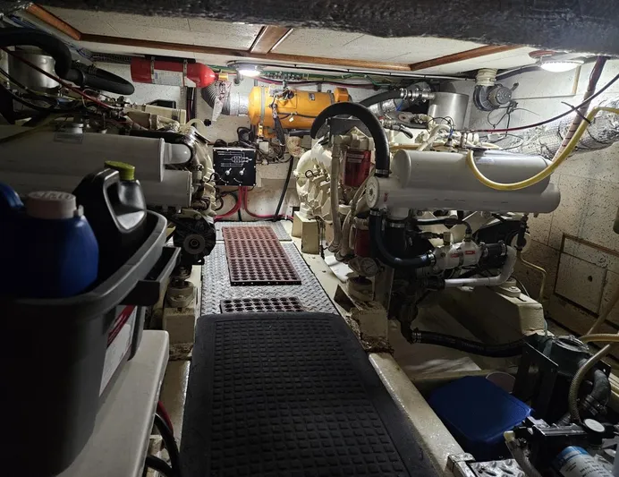 Kolea Yacht Photos Pics Engine room of 1983 Ocean Alexander 43 yacht, featuring dual engines and maintenance equipment.