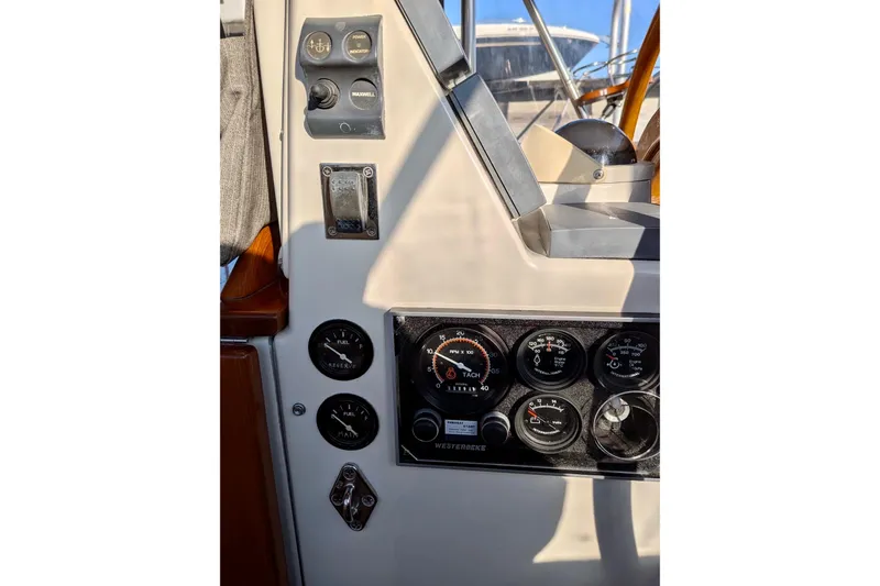  Yacht Photos Pics Control panel of a 2003 Gozzard 37 boat with gauges and switches.