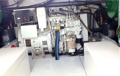 Proud Lady Yacht Photos Pics Engine room of a 1957 Rybovich Convertible boat, showcasing mechanical components and wiring.