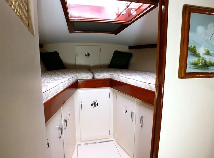 Proud Lady Yacht Photos Pics 1957 Rybovich Convertible cabin interior with twin beds and skylight.