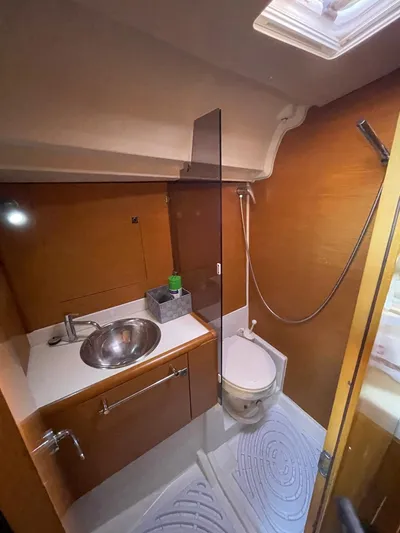  Yacht Photos Pics 2011 Jeanneau Sun Odyssey 439 bathroom with sink, toilet, and shower.