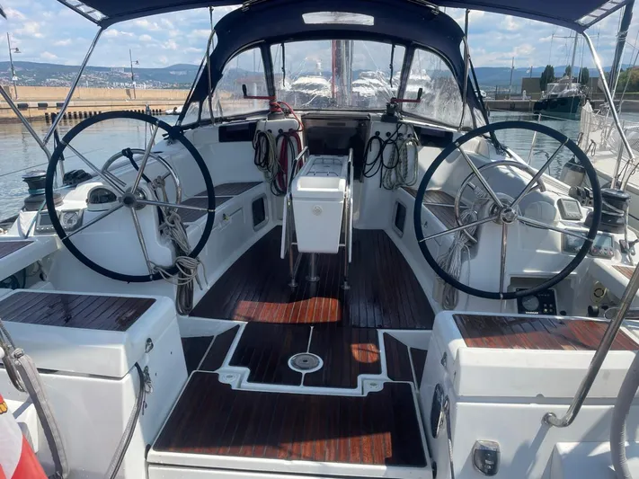  Yacht Photos Pics 2011 Jeanneau Sun Odyssey 439 sailboat cockpit with dual steering wheels and wood flooring.