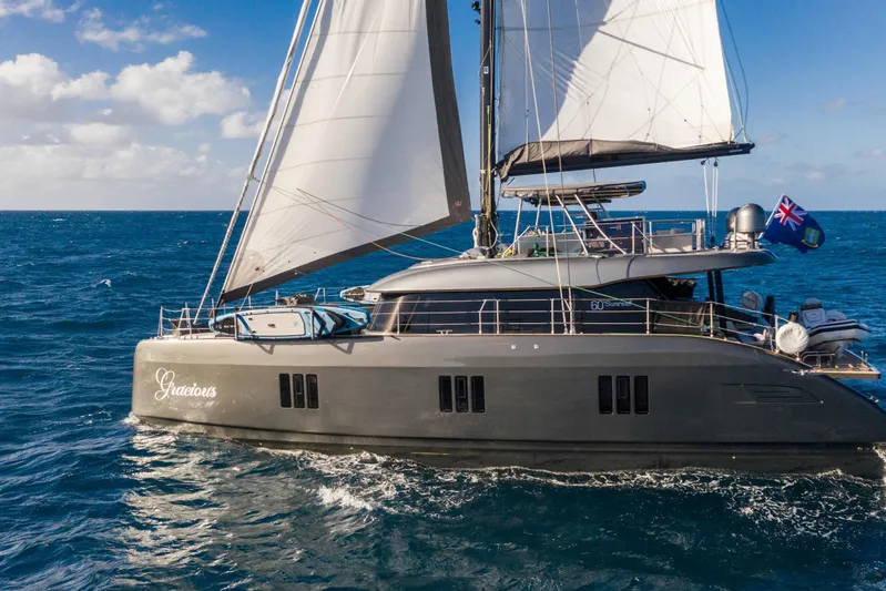 Gracious Yacht Photos Pics 2021 Sunreef 60 yacht sailing on open sea under clear skies.