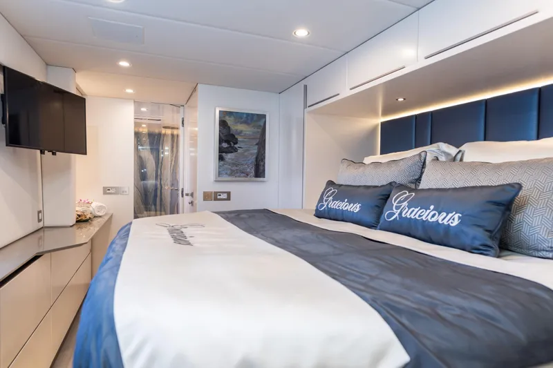 Gracious Yacht Photos Pics Luxurious Sunreef 60 yacht bedroom interior, 2021 model, featuring elegant bedding and modern decor.