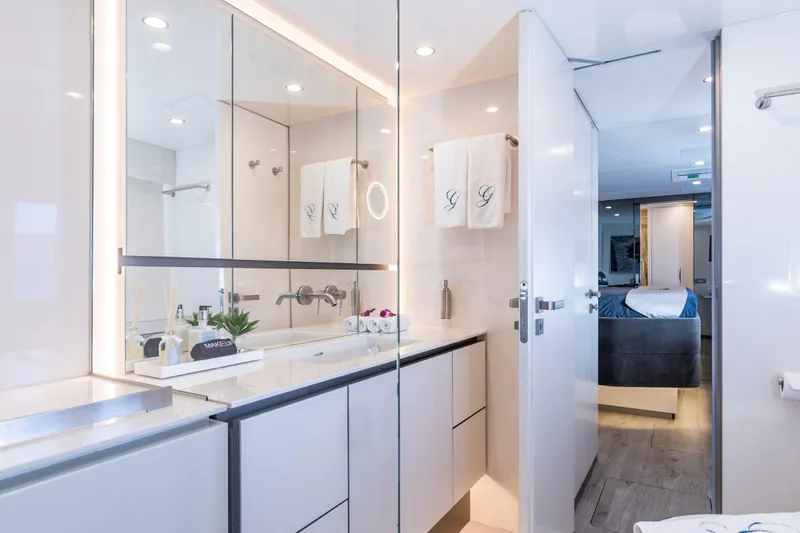 Gracious Yacht Photos Pics Luxurious bathroom interior of 2021 Sunreef 60 yacht with modern fixtures and elegant design.