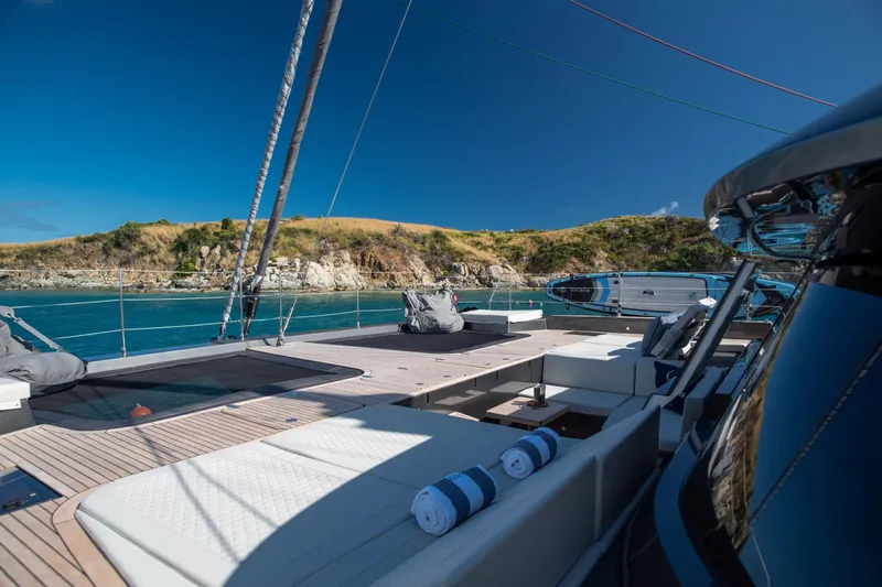 Gracious Yacht Photos Pics Luxurious 2021 Sunreef 60 yacht deck with scenic coastal view.