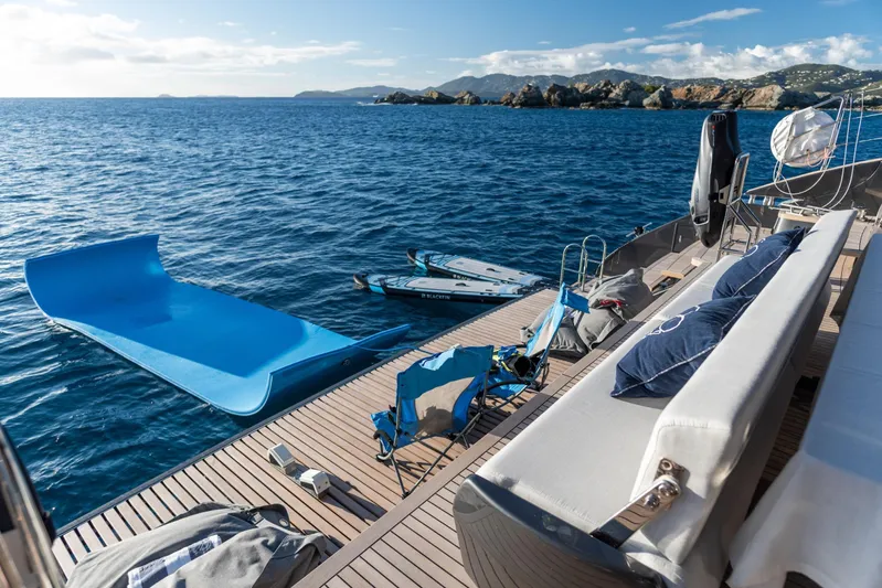 Gracious Yacht Photos Pics Luxury Sunreef 60 yacht deck with slide and water toys, 2021 model, scenic ocean view.