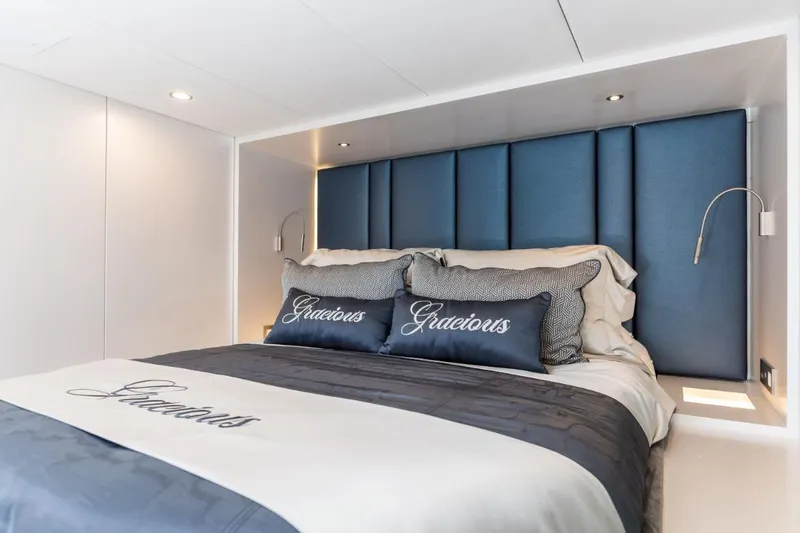 Gracious Yacht Photos Pics Luxurious bedroom interior on 2021 Sunreef 60 yacht with elegant blue accents.