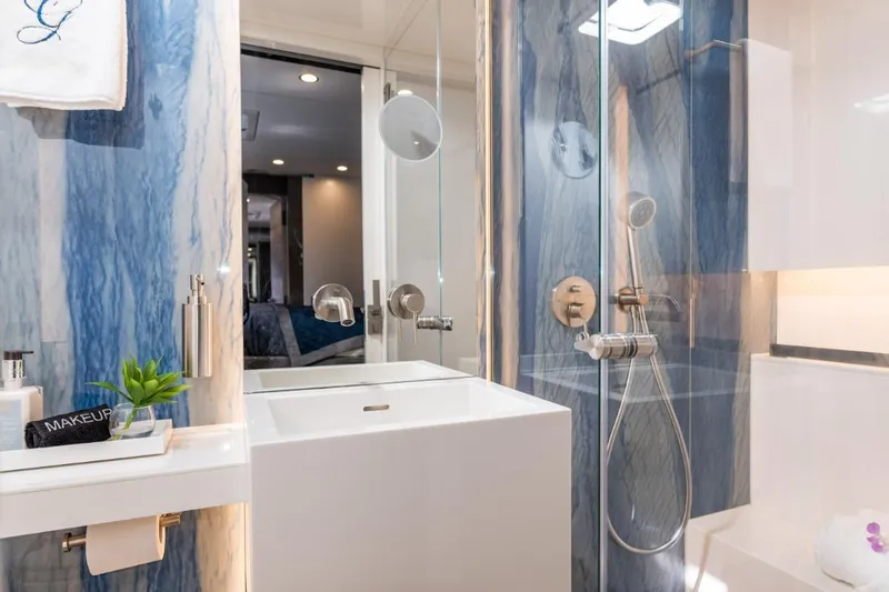 Gracious Yacht Photos Pics Luxurious bathroom in 2021 Sunreef 60 yacht with modern fixtures and elegant blue accents.
