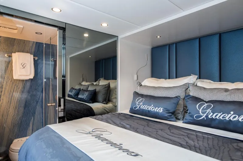 Gracious Yacht Photos Pics Luxurious bedroom interior on 2021 Sunreef 60 yacht, featuring elegant bedding and modern design.
