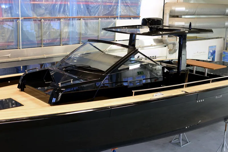 Windy Sr52 Yacht Photos Pics 2021 Windy SR52 yacht in a workshop, showcasing sleek black design and modern features.