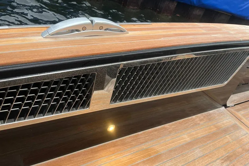 Windy Sr52 Yacht Photos Pics Teak deck detail of 2021 Windy SR52 yacht with metal vent and cleat.