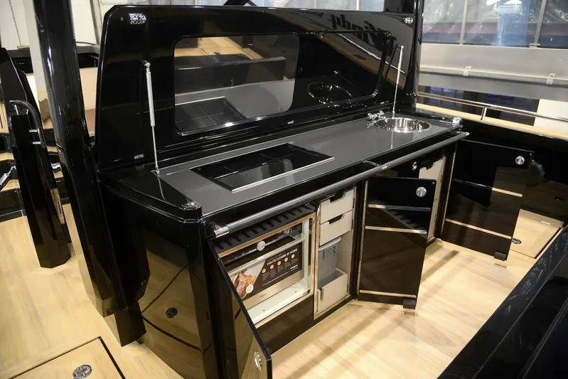 Windy Sr52 Yacht Photos Pics Luxurious 2021 Windy SR52 yacht kitchen with sleek black cabinetry and modern appliances.