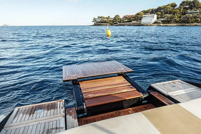 Windy Sr52 Yacht Photos Pics Luxury yacht Windy SR52, 2021 model, with elegant wooden deck on serene ocean.