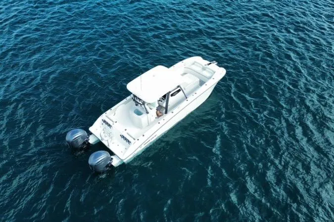  Yacht Photos Pics 2026 Twin Vee 280 GFX2 CC boat on open water, aerial view.
